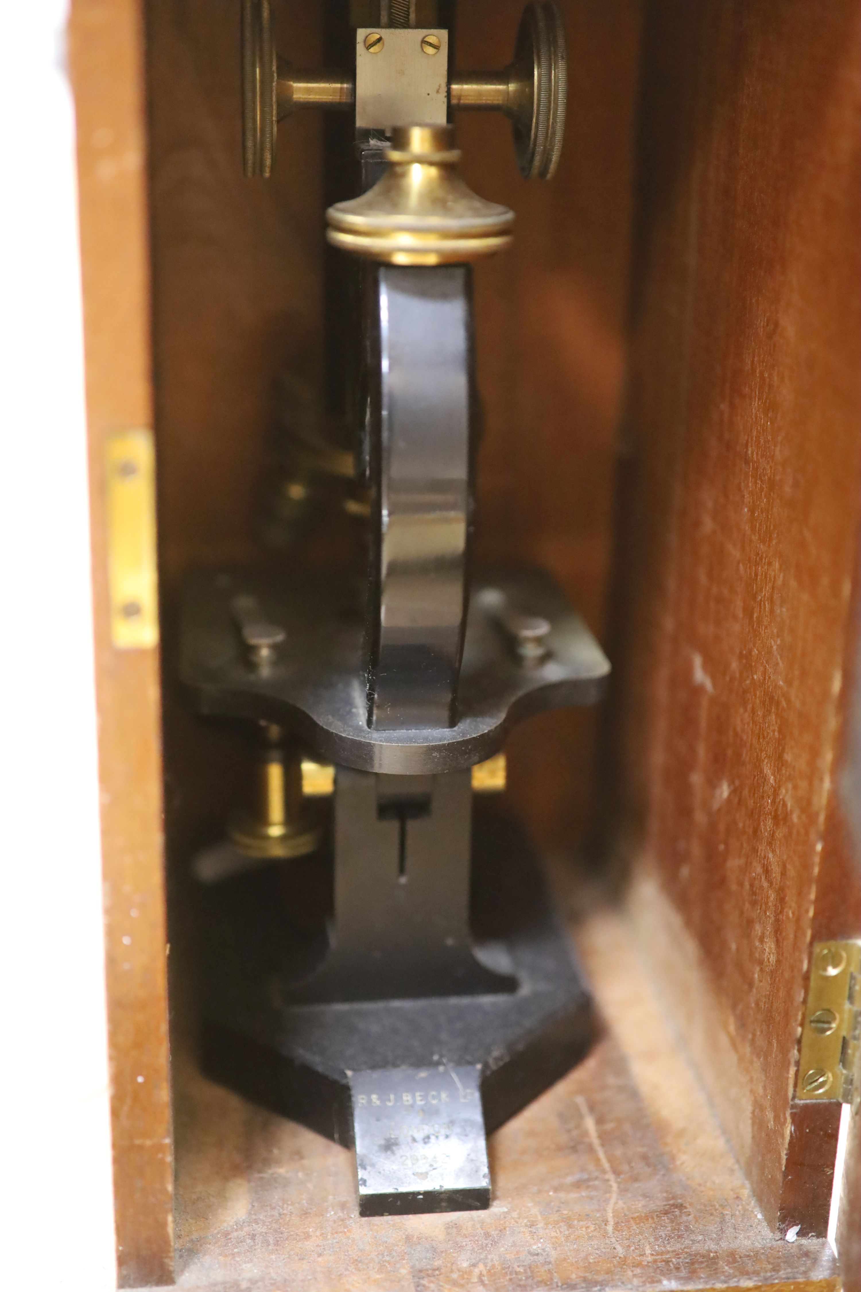 A mahogany cased microscope and veterinary equipment